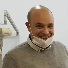Dt. Ahmet Çobanoğlu — Diş Hekimi. Portre fotoğrafı.