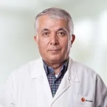 Prof. Dr. Hüsnü Güzel — Göz Hastalıkları, İstanbul. Portre fotoğrafı.