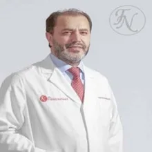 Prof. Dr. L. Ertan Sağbaş — Kalp Ve Damar Cerrahisi, İstanbul. Portre fotoğrafı.