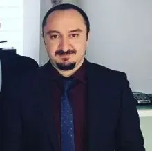 Dr. Öğr. Üyesi Orhan Aksoy — Ortodonti, Ankara. Portre fotoğrafı.