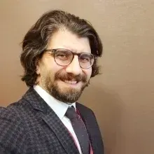 Doç. Dr. Erkam Kömürcü — Ortopedi Ve Travmatoloji, Bursa. Portre fotoğrafı.