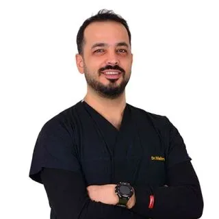 Dt. Mehmet İnal — Diş Hekimi, Malatya. Portre fotoğrafı.