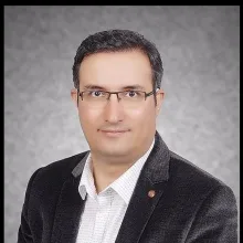 Prof. Dr. Emin Caner Tümen — Çocuk Diş Hekimliği (Pedodonti), Diyarbakır. Portre fotoğrafı.