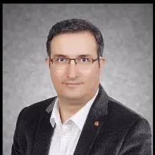 Prof. Dr. Emin Caner Tümen — Çocuk Diş Hekimliği (Pedodonti), Diyarbakır. Portre fotoğrafı.