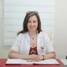 Uzm. Dr. Pınar Yönter Oğuz — Dermatoloji, Beşiktaş, İstanbul. Portre fotoğrafı.