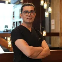 Doç. Dr. Ergün Sevil — Kulak Burun Boğaz, Antalya. Portre fotoğrafı.
