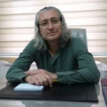 Uzm. Dr. Hasan Kenarlı — Psikiyatri. Portre fotoğrafı.