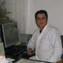 Dt. Ahmet Erhan Artar — Diş Hekimi, Alanya, Antalya. Portre fotoğrafı.