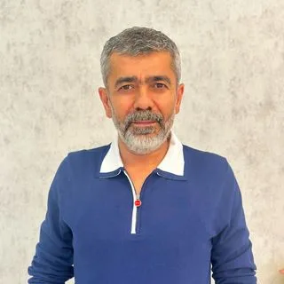 Dr. Erhan Çömü — Pratisyen, Konya. Portre fotoğrafı.