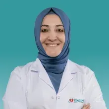 Uzm. Dr. Aslıhan Banu Er — Göğüs Hastalıkları, Denizli. Portre fotoğrafı.