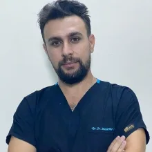 Op. Dr. Muzaffer İnan — Kulak Burun Boğaz, İstanbul. Portre fotoğrafı.