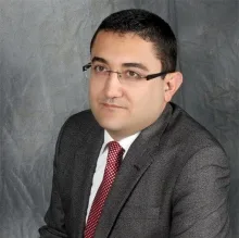 Doç. Dr. Kudret Çağlar — Çocuk Sağlığı Ve Hastalıkları. Portre fotoğrafı.