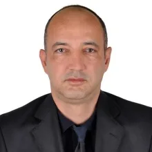 Prof. Dr. Hüseyin Tuğsan Ballı — Radyoloji, Seyhan, Adana. Portre fotoğrafı.