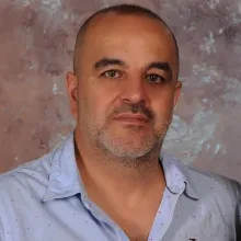 Op. Dr. Erhan Muluk — Kadın Hastalıkları Ve Doğum, Antalya. Portre fotoğrafı.