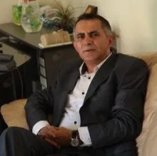 Uzm. Dr. Hüsamettin Güldoğan — Psikiyatri, Sarıyer, İstanbul. Portre fotoğrafı.