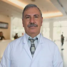 Op. Dr. Gültekin Erdoğan — Beyin Ve Sinir Cerrahisi, Kuşadası, Aydın. Portre fotoğrafı.
