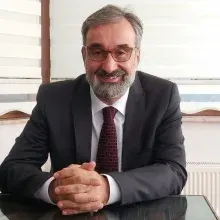 Uzm. Dr. Hilmi Çuhadaroğlu — Göz Hastalıkları, Ankara. Portre fotoğrafı.