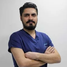 Dt. Mehmet Beşir Alp — Diş Hekimi, Siirt. Portre fotoğrafı.