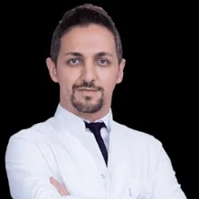 Op. Dr. Düzgün Ateş — Kulak Burun Boğaz, İzmir. Portre fotoğrafı.