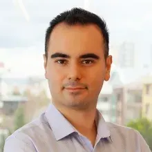 Doç. Dr. Hakan Öğütlü — Çocuk ve Ergen Psikiyatrisi, Ankara. Portre fotoğrafı.