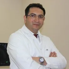 Doç. Dr. Ali Seven — Ankara. Portre fotoğrafı.