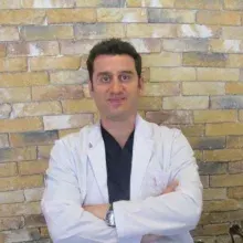 Dr. Dt. Sertaç Sert — Periodontoloji, Ankara. Portre fotoğrafı.