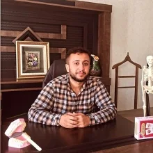 Dkt. Ahmet Erkut — Dil ve Konuşma Terapisi. Portre fotoğrafı.
