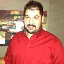 Dt. Ercan Aga — Diş Hekimi, Ankara. Portre fotoğrafı.