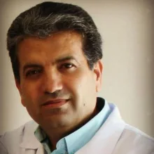 Uzm. Dr. Mukhtar Faith Mohamed — Çocuk Sağlığı Ve Hastalıkları, İzmir. Portre fotoğrafı.