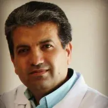 Uzm. Dr. Mukhtar Faith Mohamed — Çocuk Sağlığı Ve Hastalıkları, İzmir. Portre fotoğrafı.