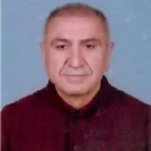 Uzm. Dr. Kamil Yücel — Göğüs Hastalıkları, Ankara. Portre fotoğrafı.