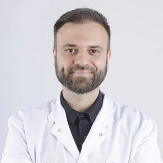 Uzm. Dr. Mehmet Mert — Denizli. Portre fotoğrafı.