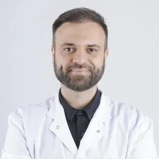 Uzm. Dr. Mehmet Mert — Denizli. Portre fotoğrafı.