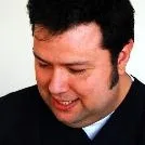 Dr. Dt. Mehmet Sarıoğlu — Ortodonti, İzmir. Portre fotoğrafı.