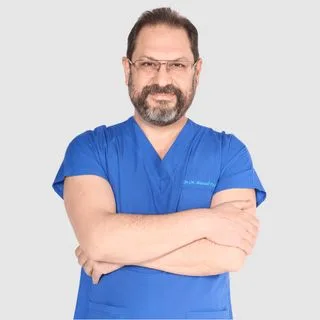 Op. Dr. Ahmed Hicran Fakraden — Kadın Hastalıkları Ve Doğum, Ankara. Portre fotoğrafı.