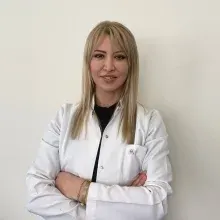 Doç. Dr. Emine Öztürk — Kadın Hastalıkları Ve Doğum, İstanbul. Portre fotoğrafı.