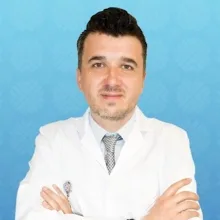 Doç. Dr. Muhsin Elmas — Tıbbi Genetik, İstanbul. Portre fotoğrafı.