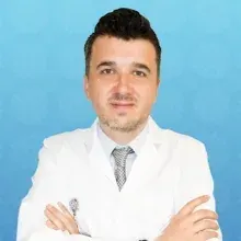 Doç. Dr. Muhsin Elmas — Tıbbi Genetik, İstanbul. Portre fotoğrafı.