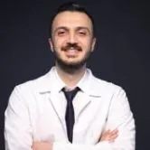 Dt. Esat Yalçın — Diş Hekimi, Gaziantep. Portre fotoğrafı.