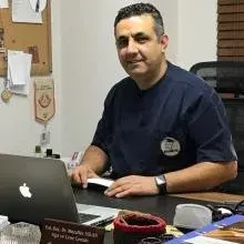 Dr. Öğr. Üyesi Muzaffer Aslan — Ağız Diş Ve Çene Cerrahisi, Seyhan, Adana. Portre fotoğrafı.