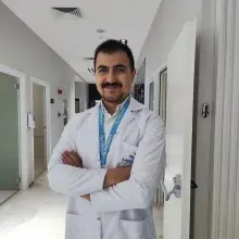 Uzm. Dr. Tuğrul Dönmez — Çocuk Sağlığı Ve Hastalıkları. Portre fotoğrafı.