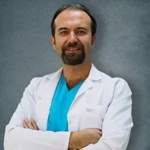 Doç. Dr. Ferdi Yavuz — Fiziksel Tıp Ve Rehabilitasyon, Ankara. Portre fotoğrafı.