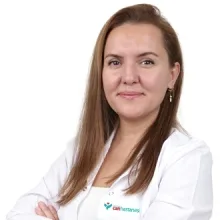 Uzm. Dr. Huriye Begüm Güney — Çocuk Sağlığı Ve Hastalıkları, Çiğli, İzmir. Portre fotoğrafı.