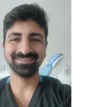 Dt. Güven Doğan — Diş Hekimi, Mersin. Portre fotoğrafı.