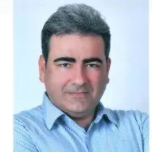 Prof. Dr. Haluk Özcanlı — Antalya. Portre fotoğrafı.