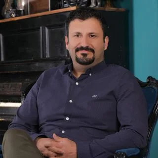 Doç. Dr. Barış Güller — Çocuk ve Ergen Psikiyatrisi. Portre fotoğrafı.