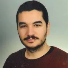 Dt. Barış Açıkgöz — Diş Hekimi, Yozgat. Portre fotoğrafı.